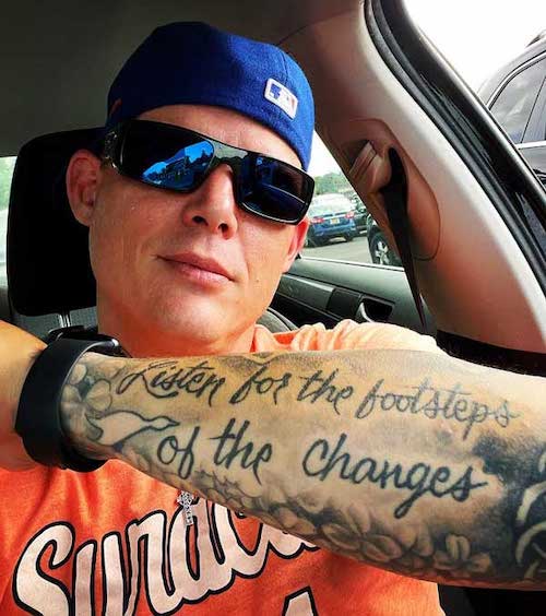 Jimmy Jennings showing his tattoo featuring lyrics from the song Heartbeat by Max Creek.